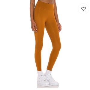 Revolve Nike One Luxe 7/8 Tight in Tawny